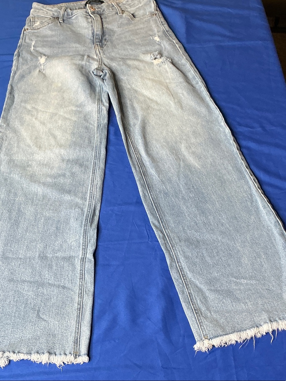BCBGeneration Light Blue Wide-Leg Jeans with Frayed Hem